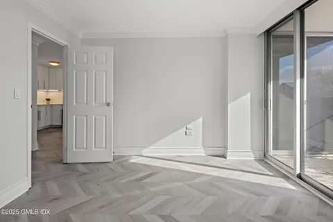 a bedroom with a bed and a night stand