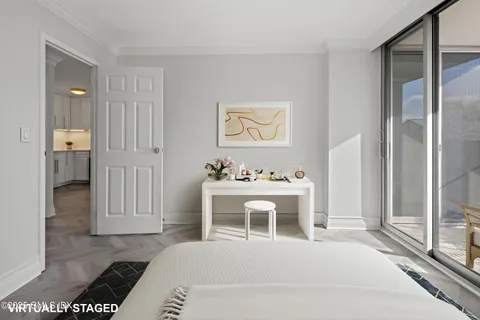 a bedroom with a bed and a potted plant