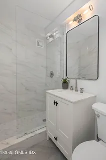 a bathroom with a toilet and a sink