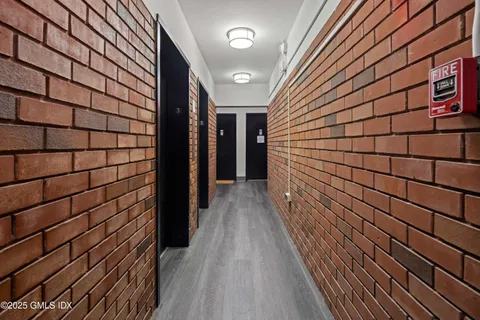 a view of a pathway with a bathroom