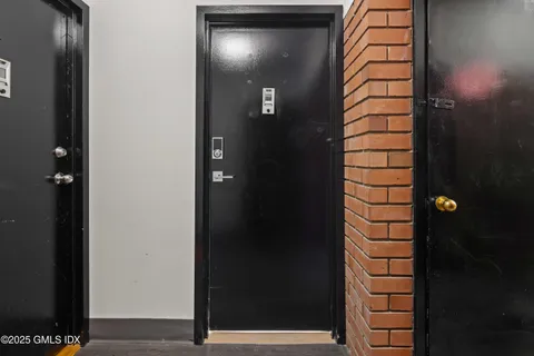 a view of a kitchen with a sink an oven and refrigerator