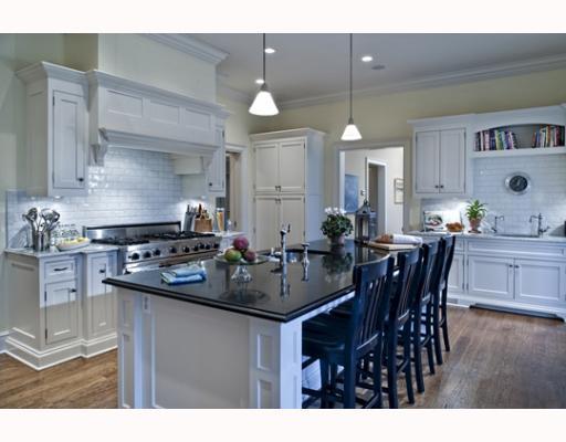 Undisclosed Address Greenwich, CT 06830 - Photo 6 of 10 a kitchen with a dining table and chairs