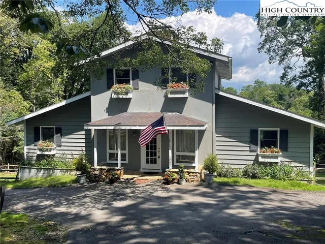 a flag is sitting in front of a house
