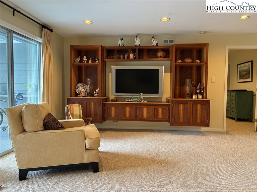 638 Ridge Road Glade Valley, NC 28627 - Photo 21 of 35 a living room with furniture and a flat screen tv