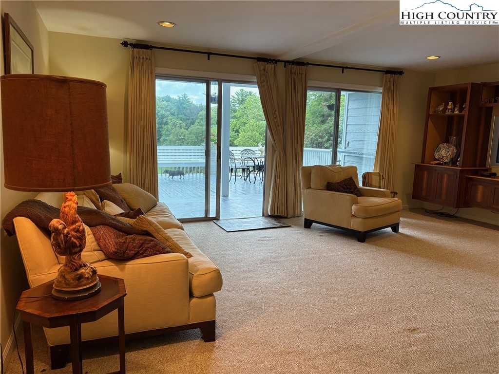 638 Ridge Road Glade Valley, NC 28627 - Photo 22 of 35 a living room with furniture and a large window