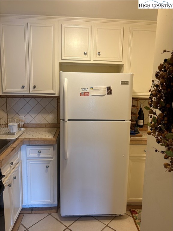 638 Ridge Road Glade Valley, NC 28627 - Photo 26 of 35 a white refrigerator freezer sitting in a kitchen