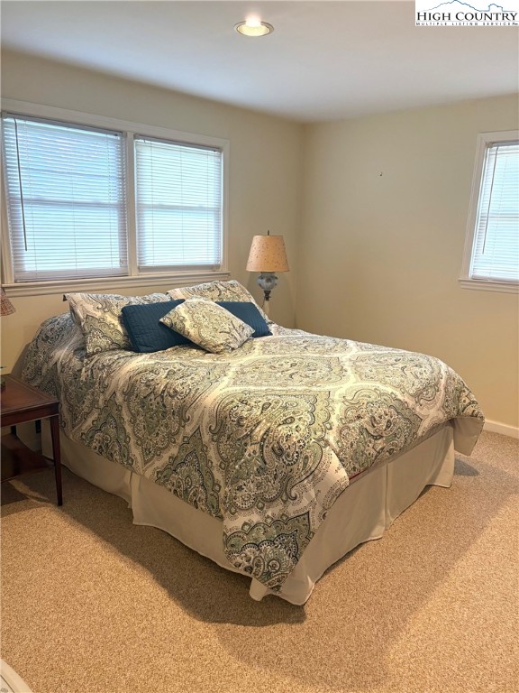 638 Ridge Road Glade Valley, NC 28627 - Photo 27 of 35 a bedroom with a bed and window