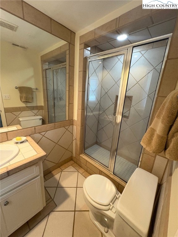638 Ridge Road Glade Valley, NC 28627 - Photo 29 of 35 a bathroom with a sink toilet and shower