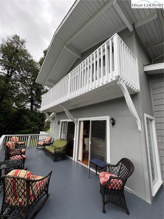 638 Ridge Road Glade Valley, NC 28627 - Photo 33 of 35 a balcony with furniture and a potted plant