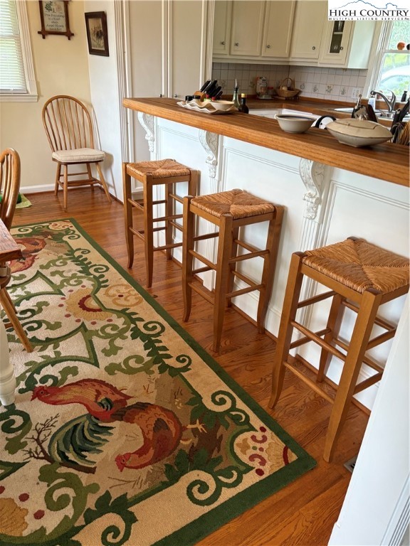 638 Ridge Road Glade Valley, NC 28627 - Photo 6 of 35 a kitchen with stainless steel appliances granite countertop a stove a sink and a microwave