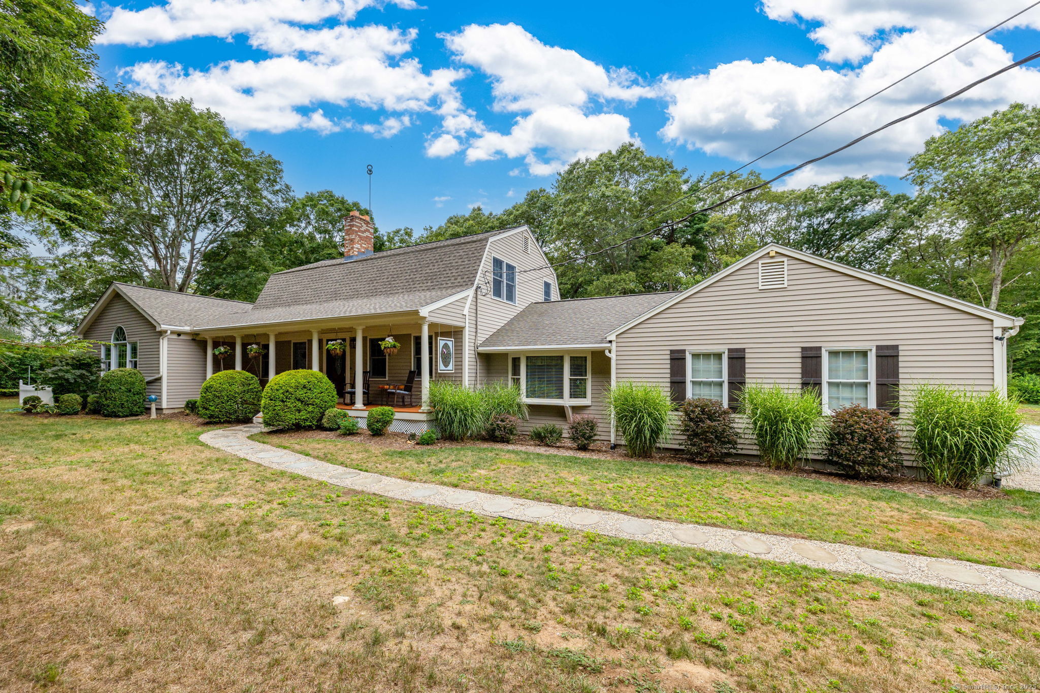 119 Isinglass Road Shelton, CT 06484 - Photo 1 of 1 a front view of a house with a garden