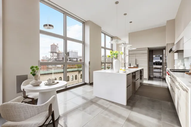 a very nice looking room with many windows and furniture