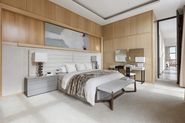 a dining room with furniture and a floor to ceiling window