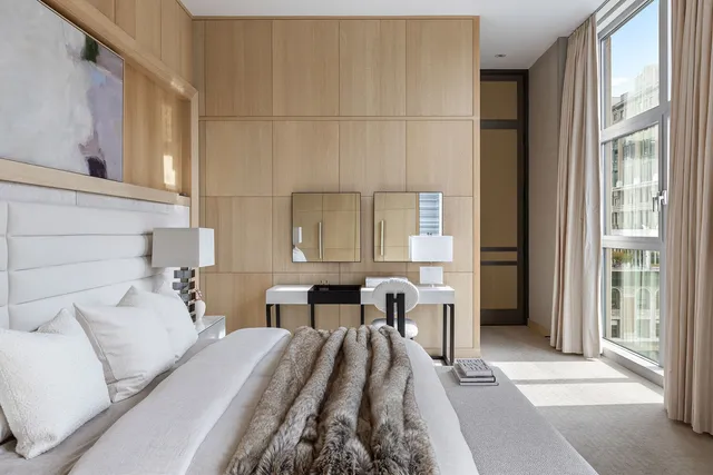 a spacious bedroom with a bed and window