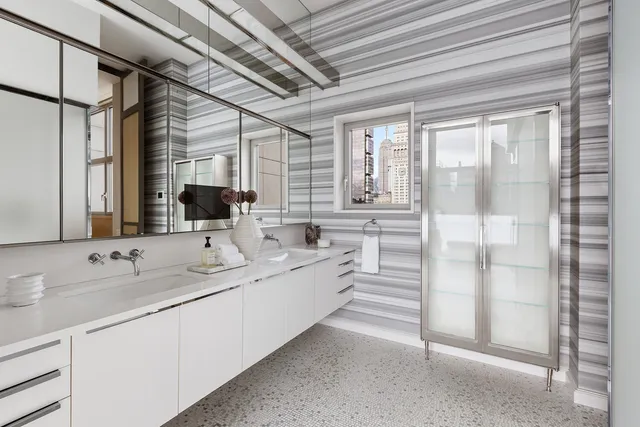 a bathroom with a bathtub and shower