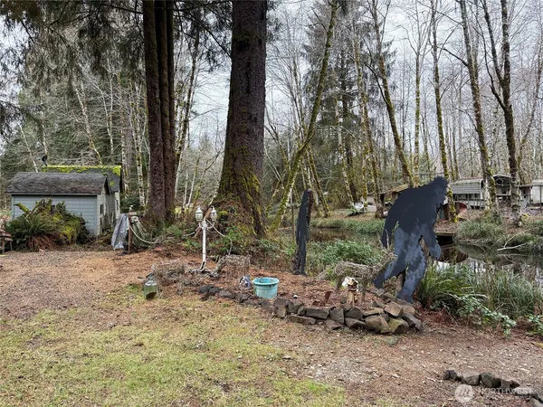 a backyard of a house with outdoor seating