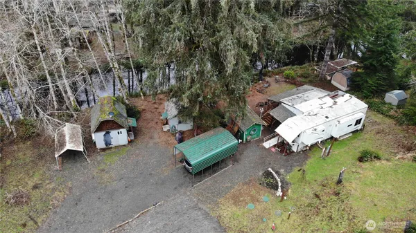 an aerial view of a house with a backyard space
