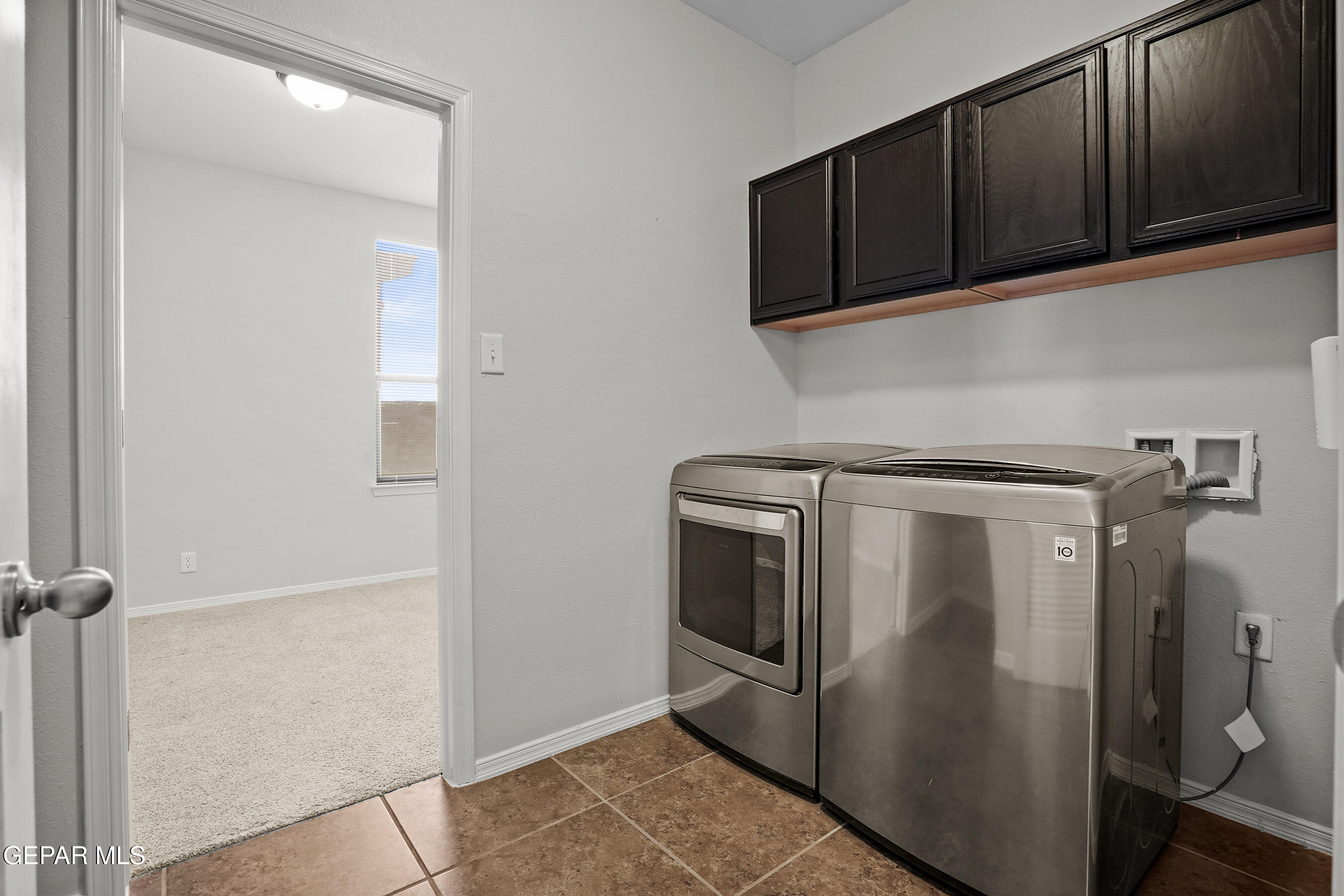 11265 Cattle Ranch Street El Paso, TX 79934 - Photo 13 of 44 a utility room with dryer and washer