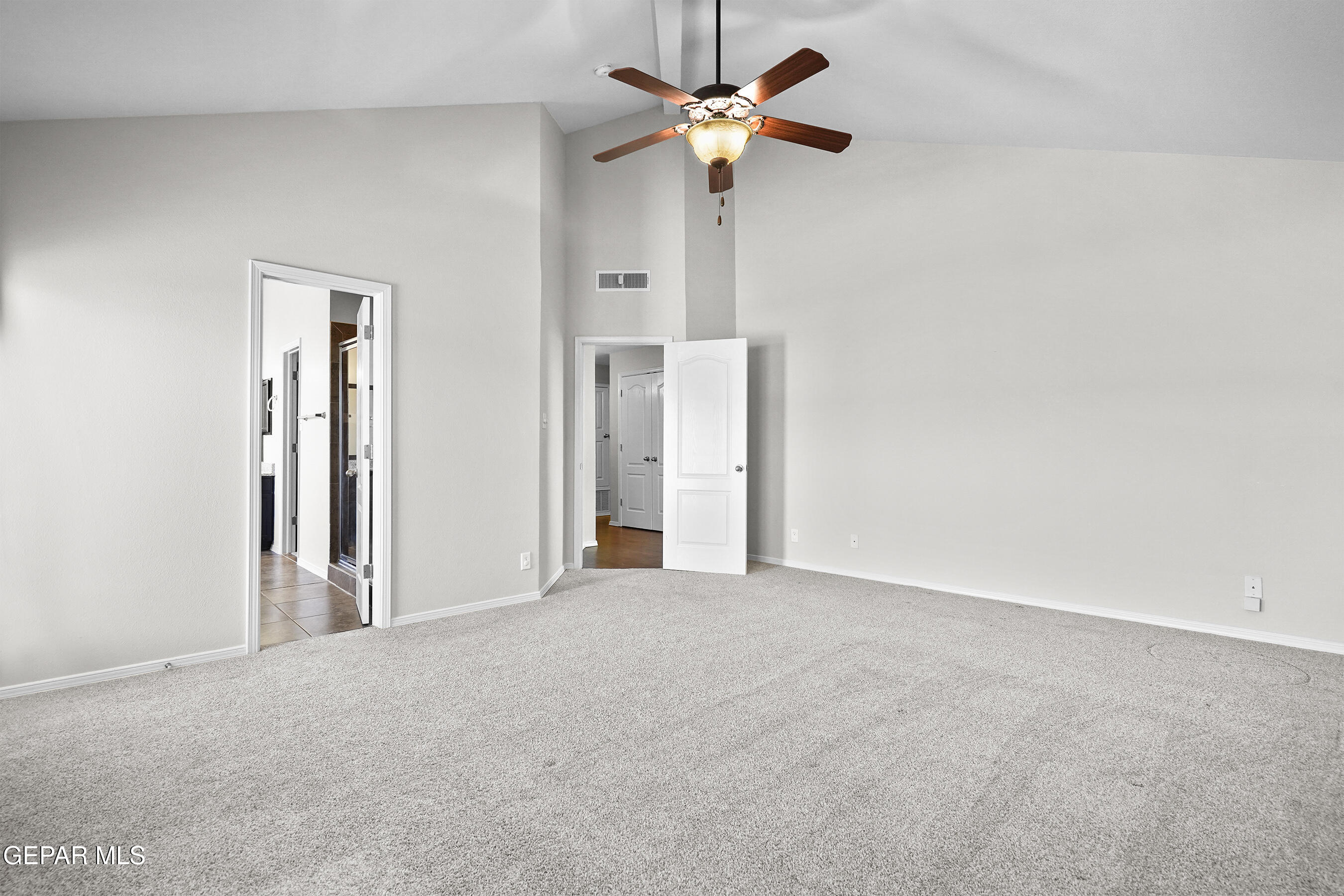 11265 Cattle Ranch Street El Paso, TX 79934 - Photo 19 of 44 an empty room with a ceiling fan and a window