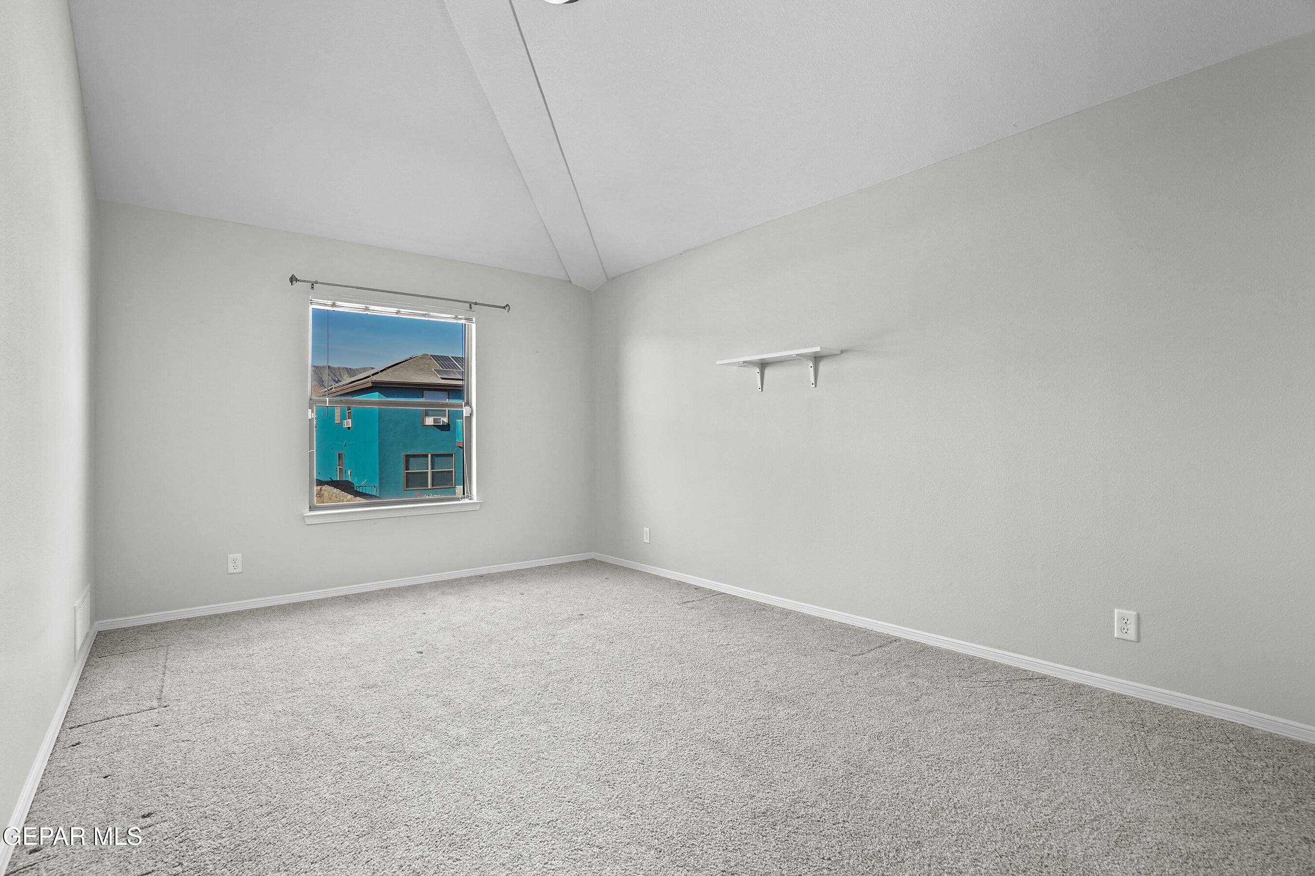 11265 Cattle Ranch Street El Paso, TX 79934 - Photo 24 of 44 an empty room with windows