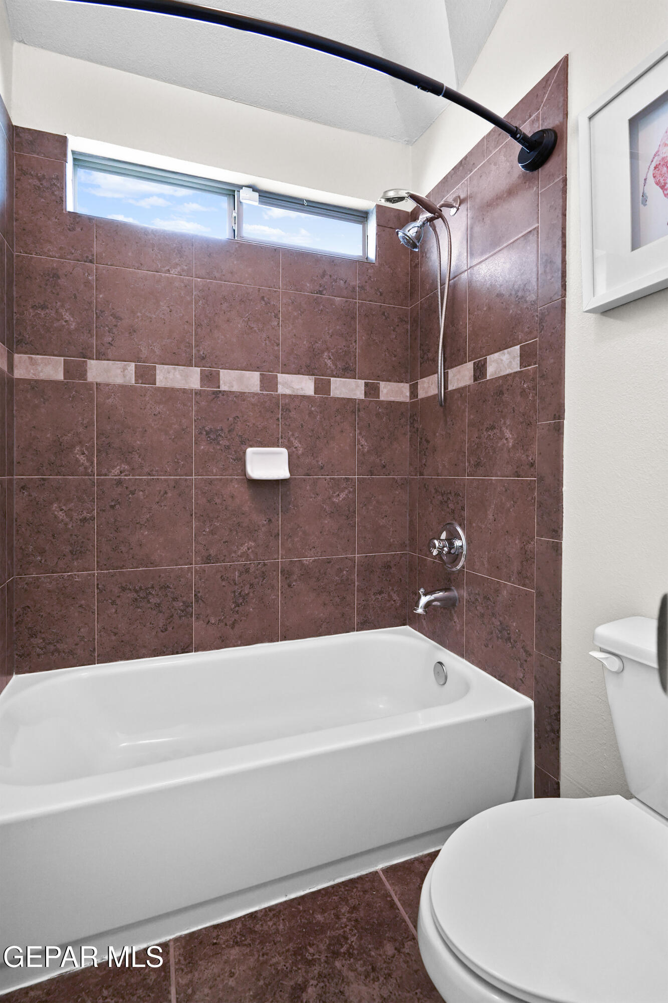 11265 Cattle Ranch Street El Paso, TX 79934 - Photo 27 of 44 a bathroom with a toilet and bathtub