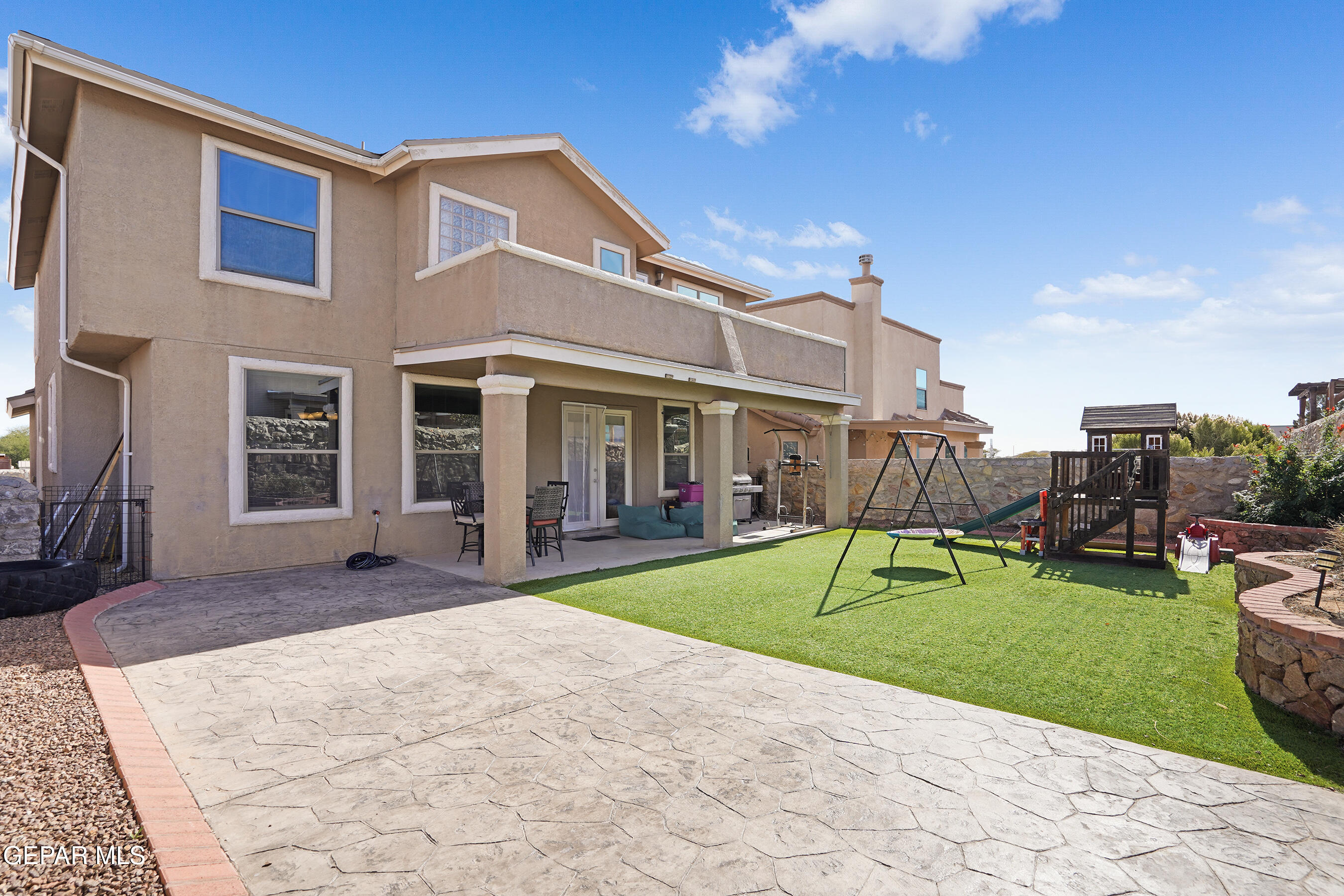 11265 Cattle Ranch Street El Paso, TX 79934 - Photo 32 of 44 a view of a building with a yard