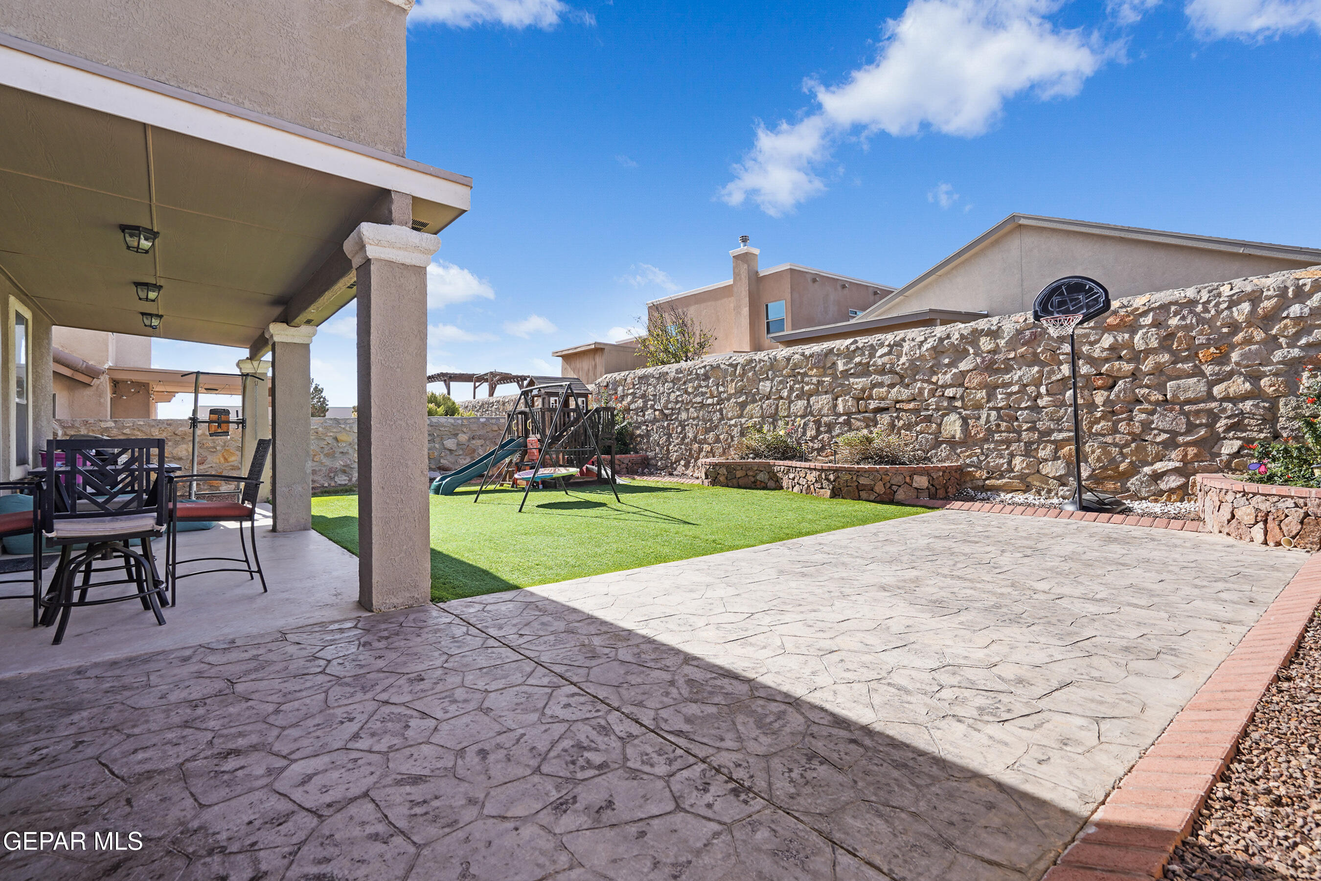 11265 Cattle Ranch Street El Paso, TX 79934 - Photo 33 of 44 a view of a backyard with sitting area