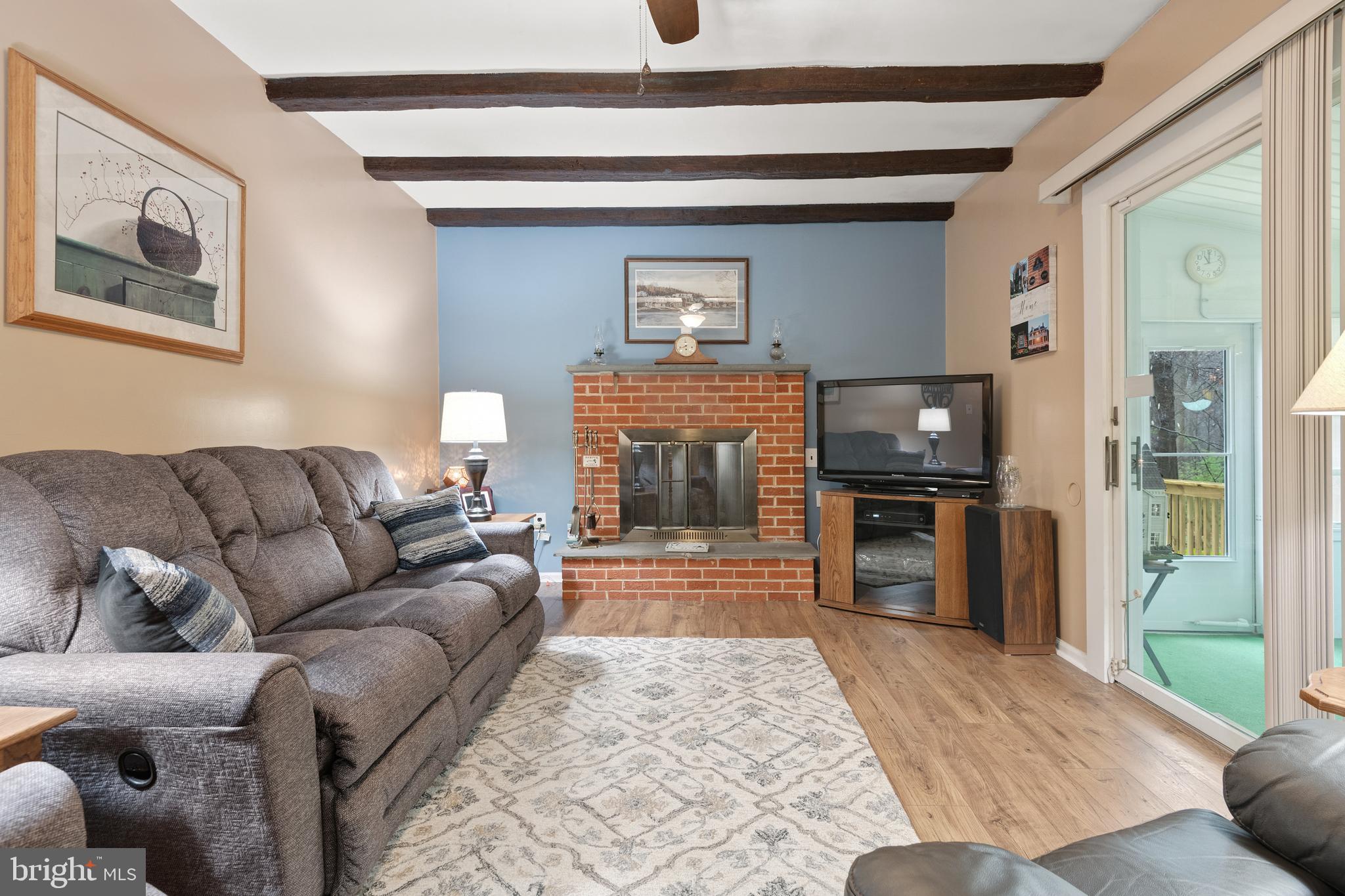 685 Chambers Rock Road Landenberg, PA 19350 - Photo 14 of 49 a living room with furniture and a fireplace