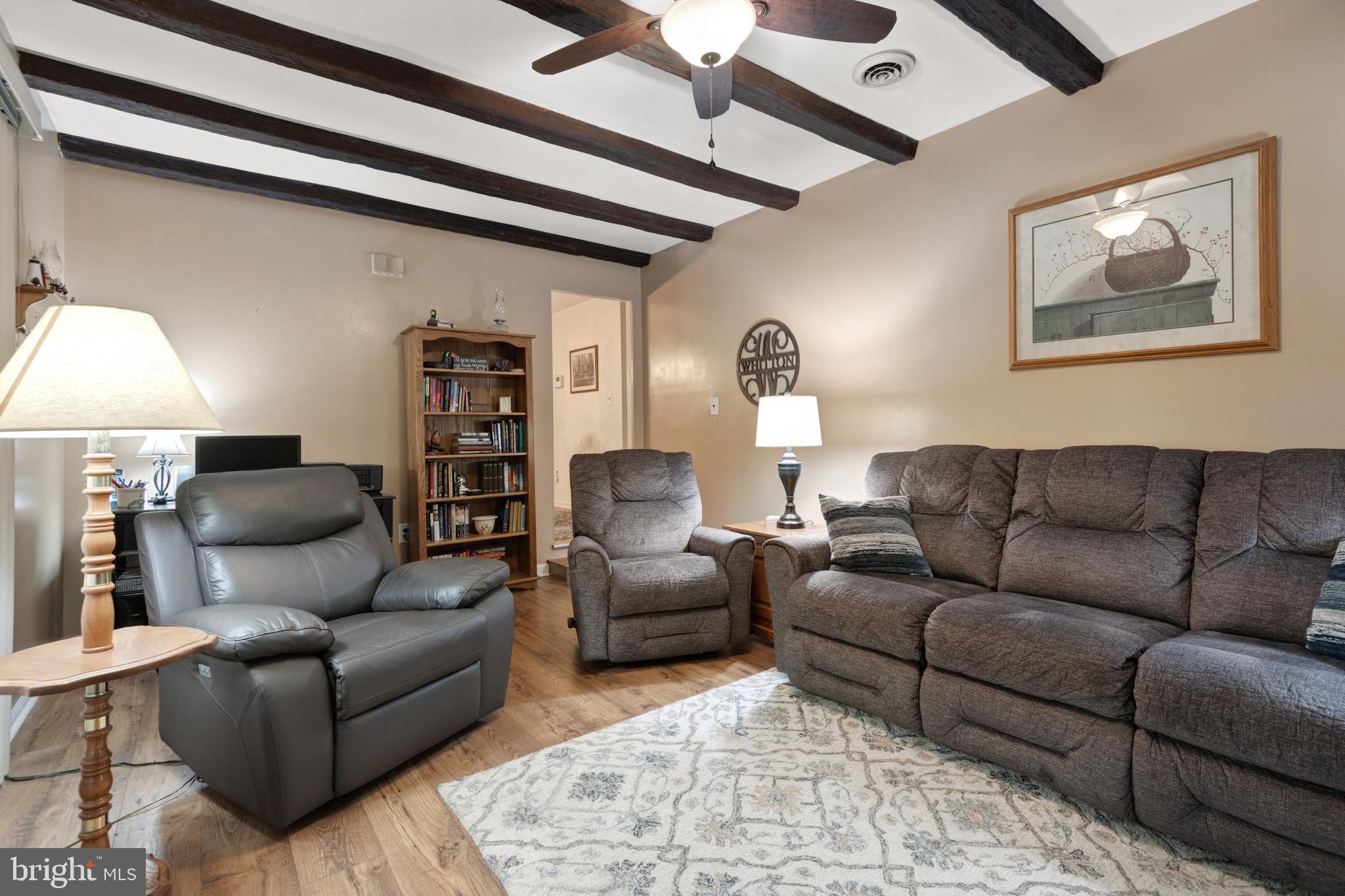 685 Chambers Rock Road Landenberg, PA 19350 - Photo 16 of 49 a living room with furniture and a lamp