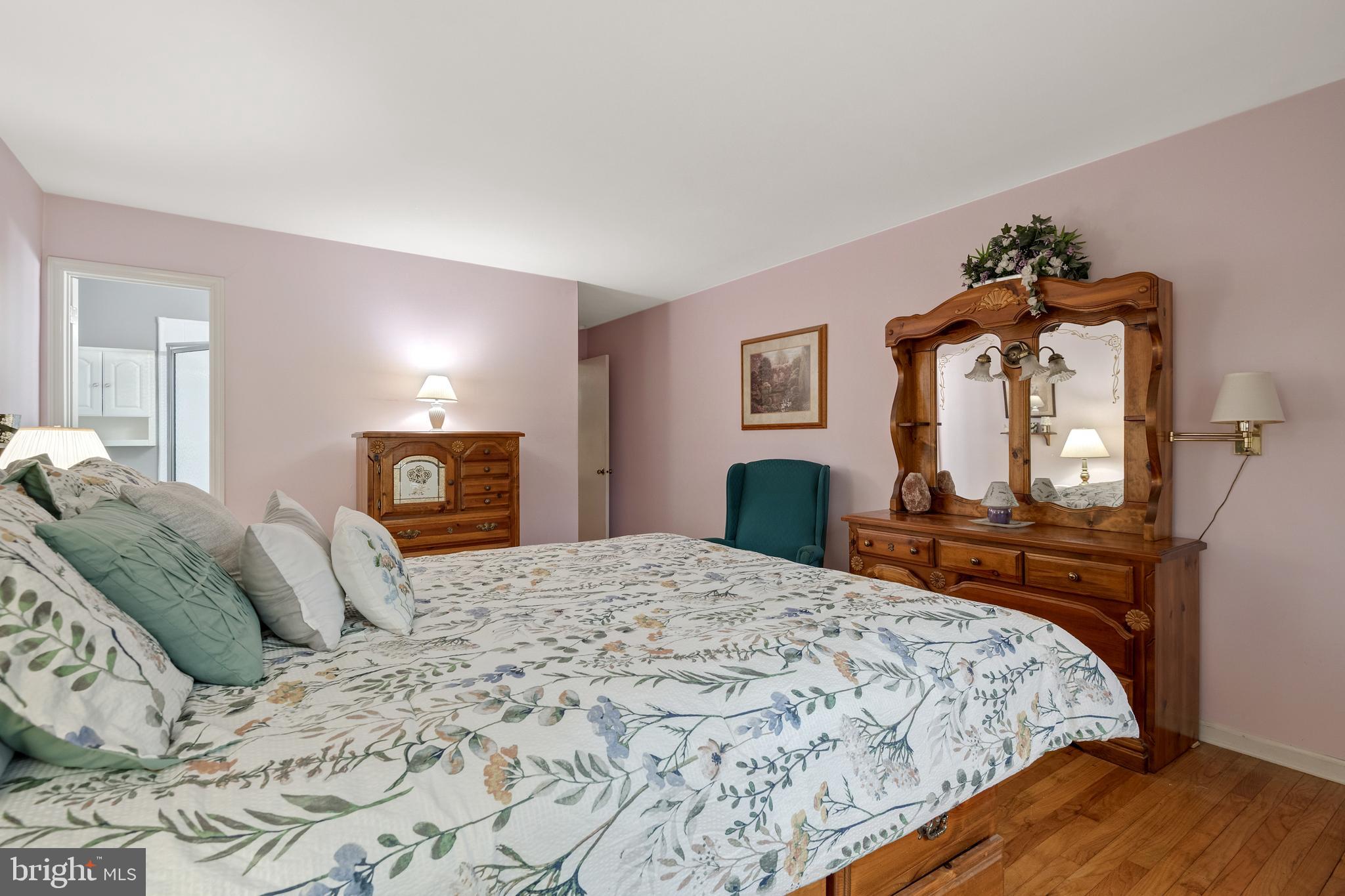 685 Chambers Rock Road Landenberg, PA 19350 - Photo 31 of 49 a bedroom with a bed and dresser with mirror
