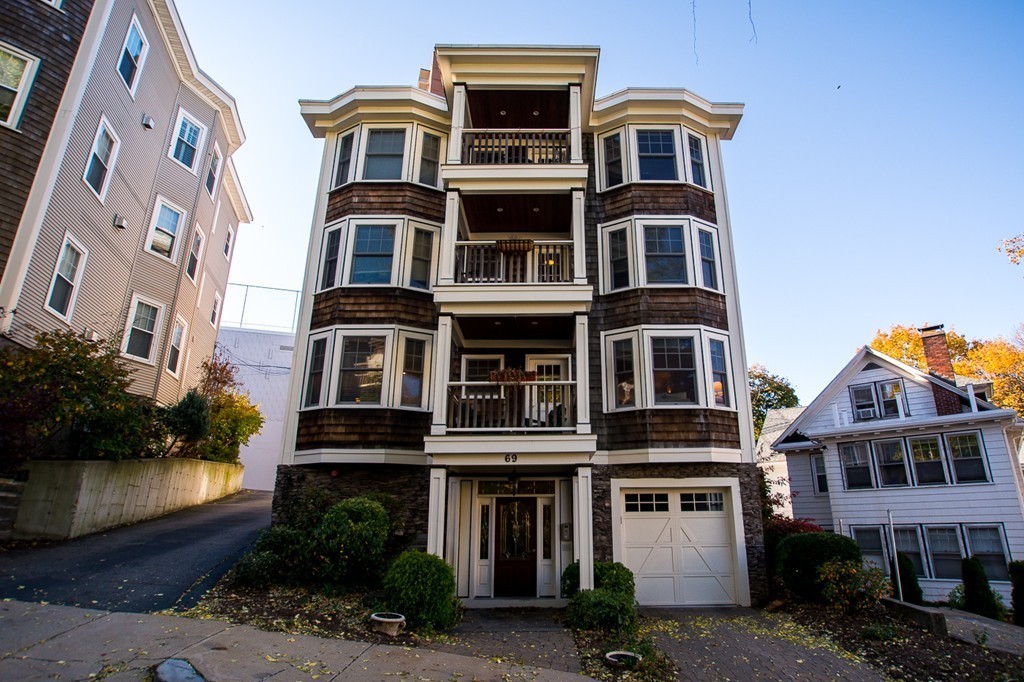 69 Parkton Road, Unit 1 Boston, MA 02130 - Photo 1 of 30 a front view of a multi story building