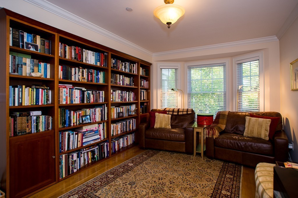 69 Parkton Road, Unit 1 Boston, MA 02130 - Photo 11 of 30 a living room with furniture and a book shelf