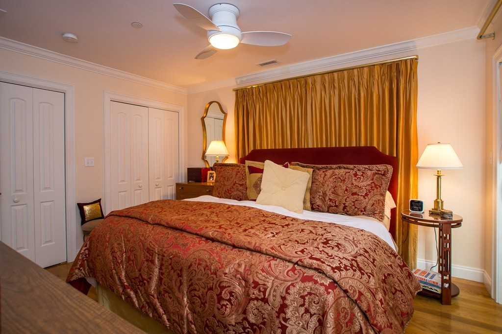 69 Parkton Road, Unit 1 Boston, MA 02130 - Photo 16 of 30 a bedroom with bed and wooden floor