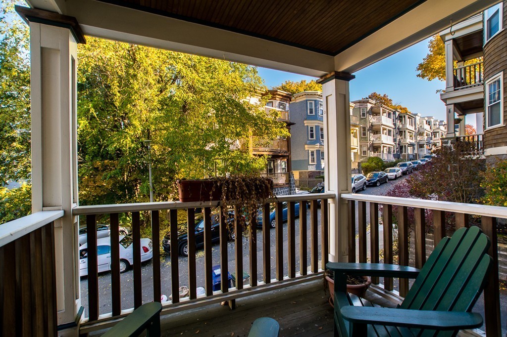 69 Parkton Road, Unit 1 Boston, MA 02130 - Photo 21 of 30 a view of a chair and table in the balcony