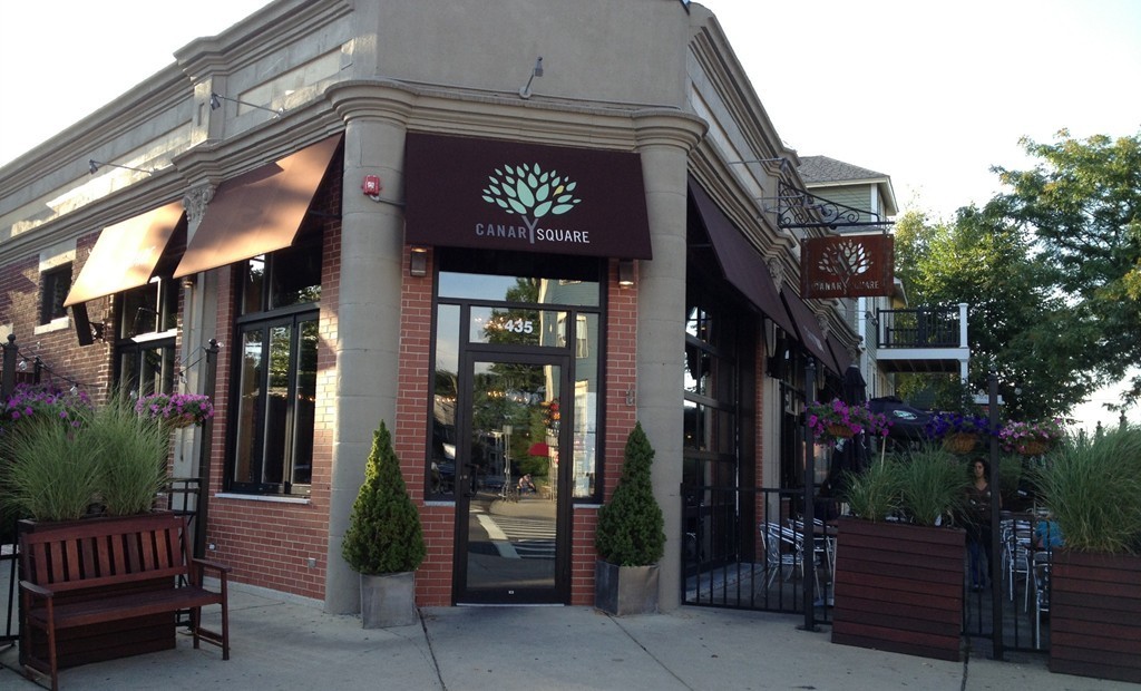 69 Parkton Road, Unit 1 Boston, MA 02130 - Photo 26 of 30 a view of a building with a tree in front of retail shop