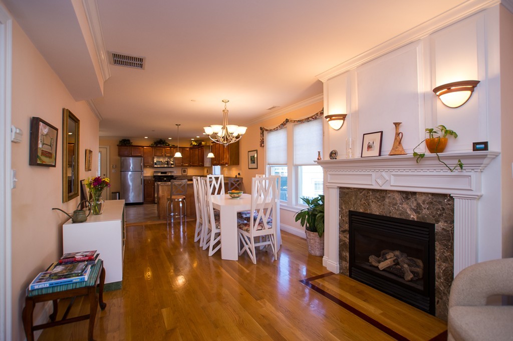 69 Parkton Road, Unit 1 Boston, MA 02130 - Photo 5 of 30 a living room with furniture and a fireplace