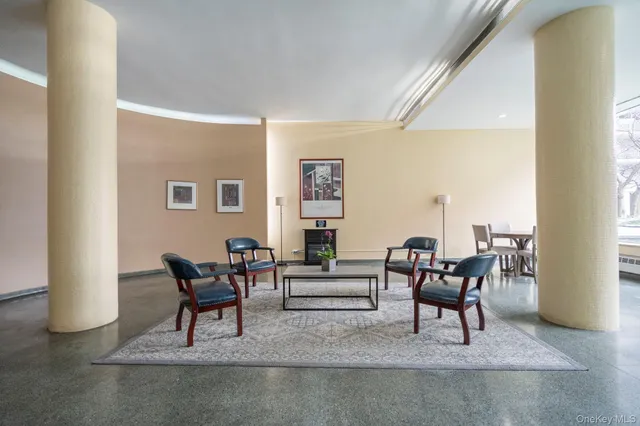 a living room with furniture and a piano