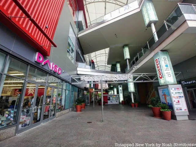 a view of group of people sitting in front of retail shop