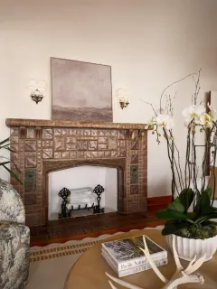 a living room with furniture and a fireplace