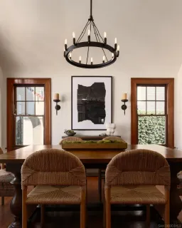 a living room with furniture a window and a chandelier