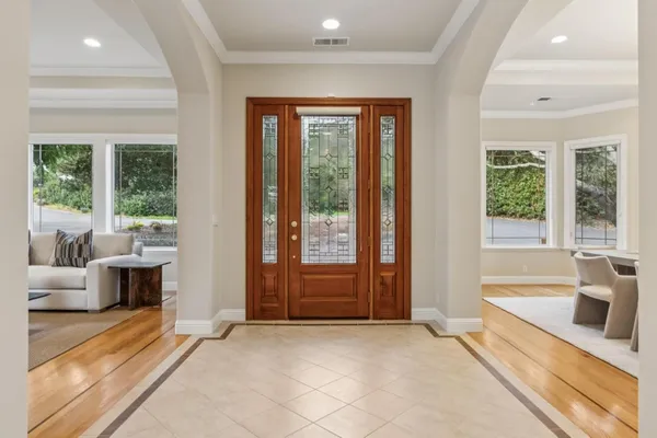 a view of a dining room with a table and chairs