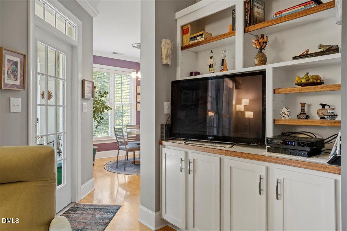 3700 Baron Cooper Pass, Unit 204 Raleigh, NC 27612 - Photo 12 of 39 a view of living room with furniture and flat screen tv