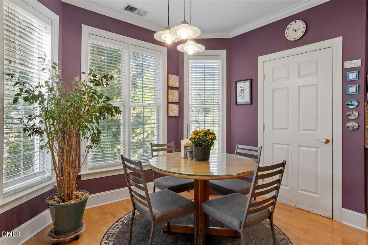 3700 Baron Cooper Pass, Unit 204 Raleigh, NC 27612 - Photo 13 of 39 a view of a dining room with furniture window and outside view