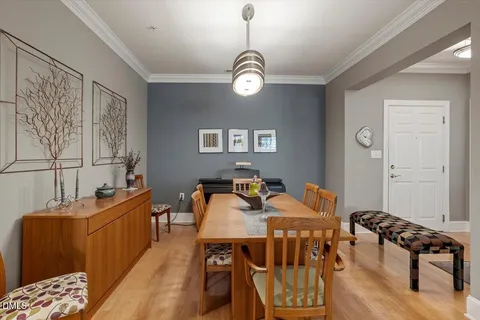a view of a livingroom with furniture and a dining table
