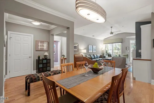 a view of a livingroom with furniture and a dining table