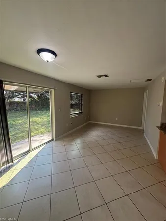 a view of an empty room and window
