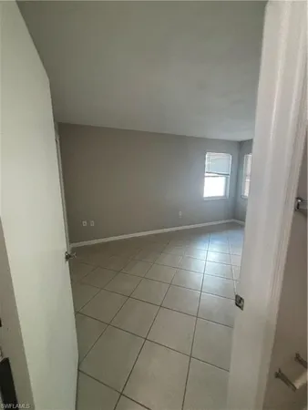 a view of an empty room and window