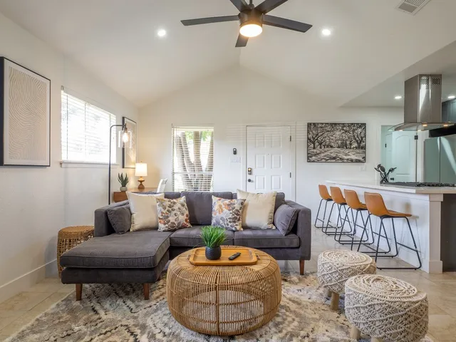 a living room with furniture and a rug
