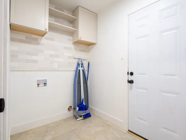 a view of walk in closet with clothes