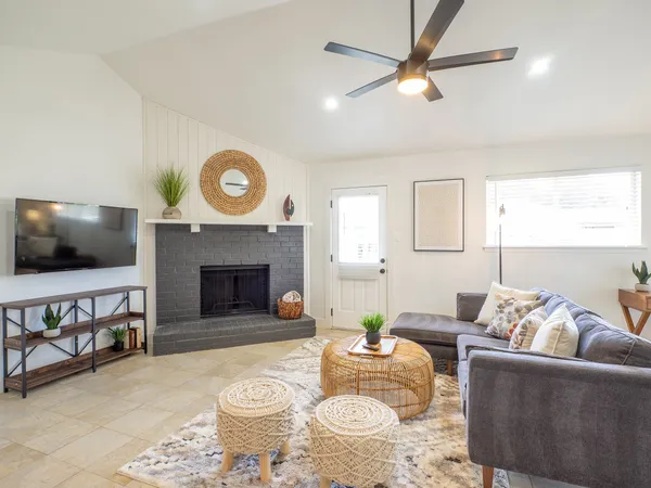 a living room with furniture and a flat screen tv